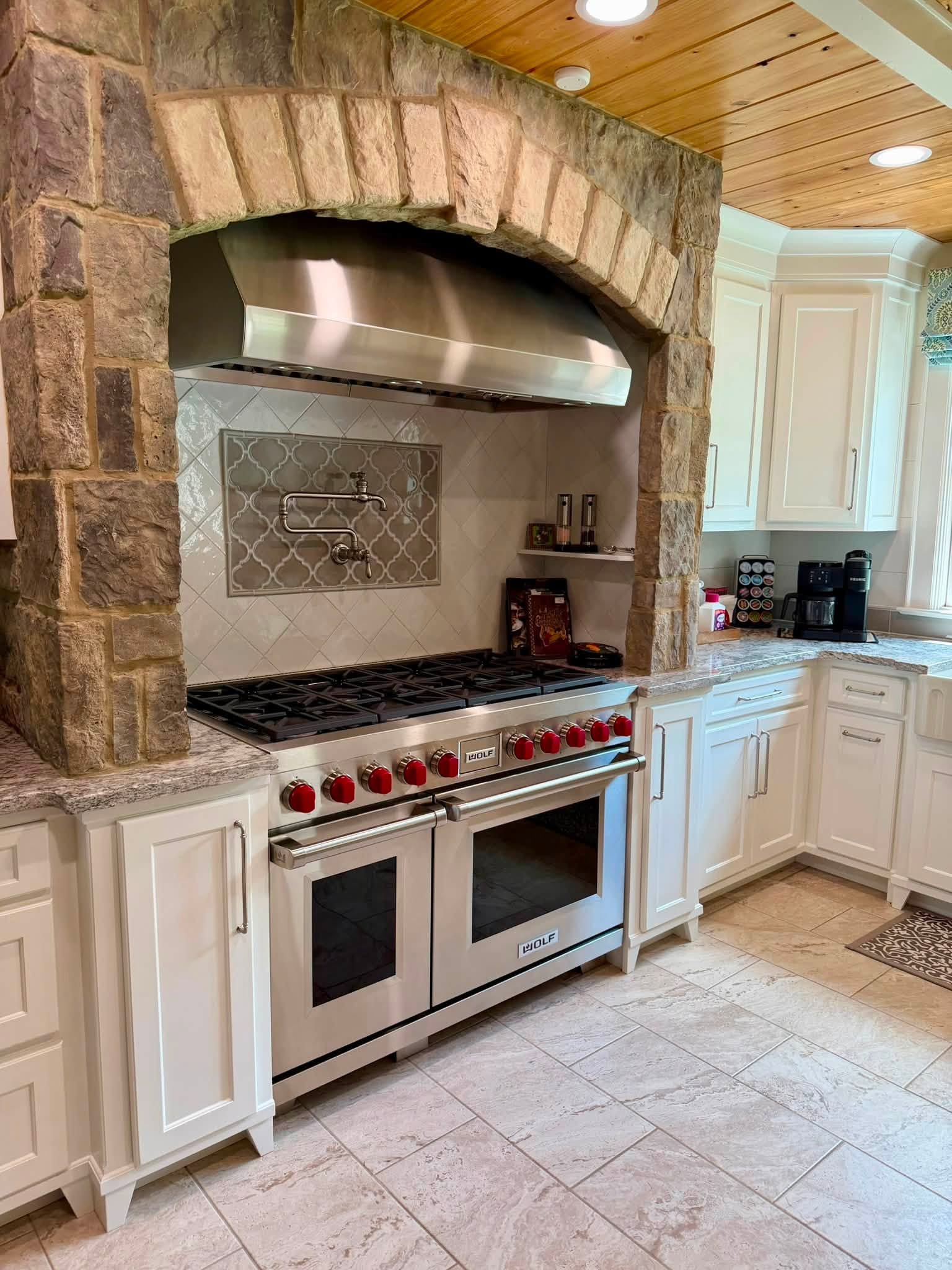 Kitchen with stone arch range