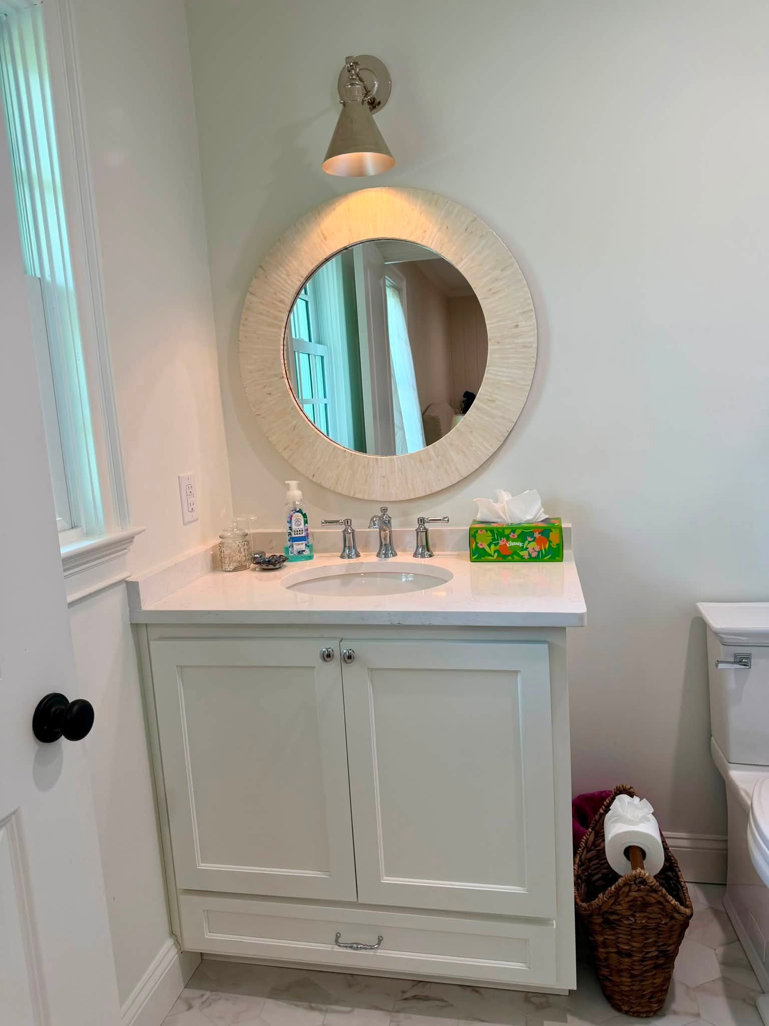 Bathroom vanity with round mirror